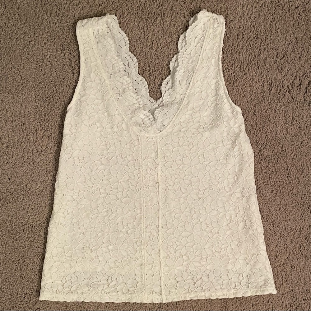 Lace white tank. Lined. Perfect alone or under a blazer or sweater. Never worn.